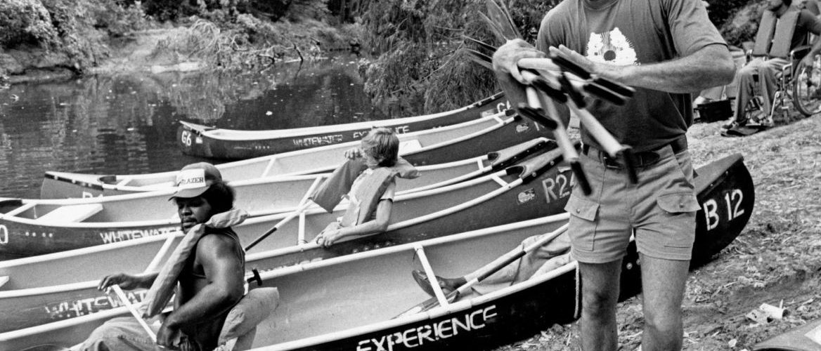 Don Greene in front of canoe